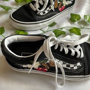 Vans tie up shoes with patched look on the side